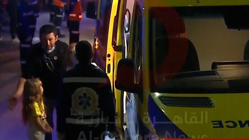 Hostages Released: Young Girl Exits Ambulance at Rafah Crossing
