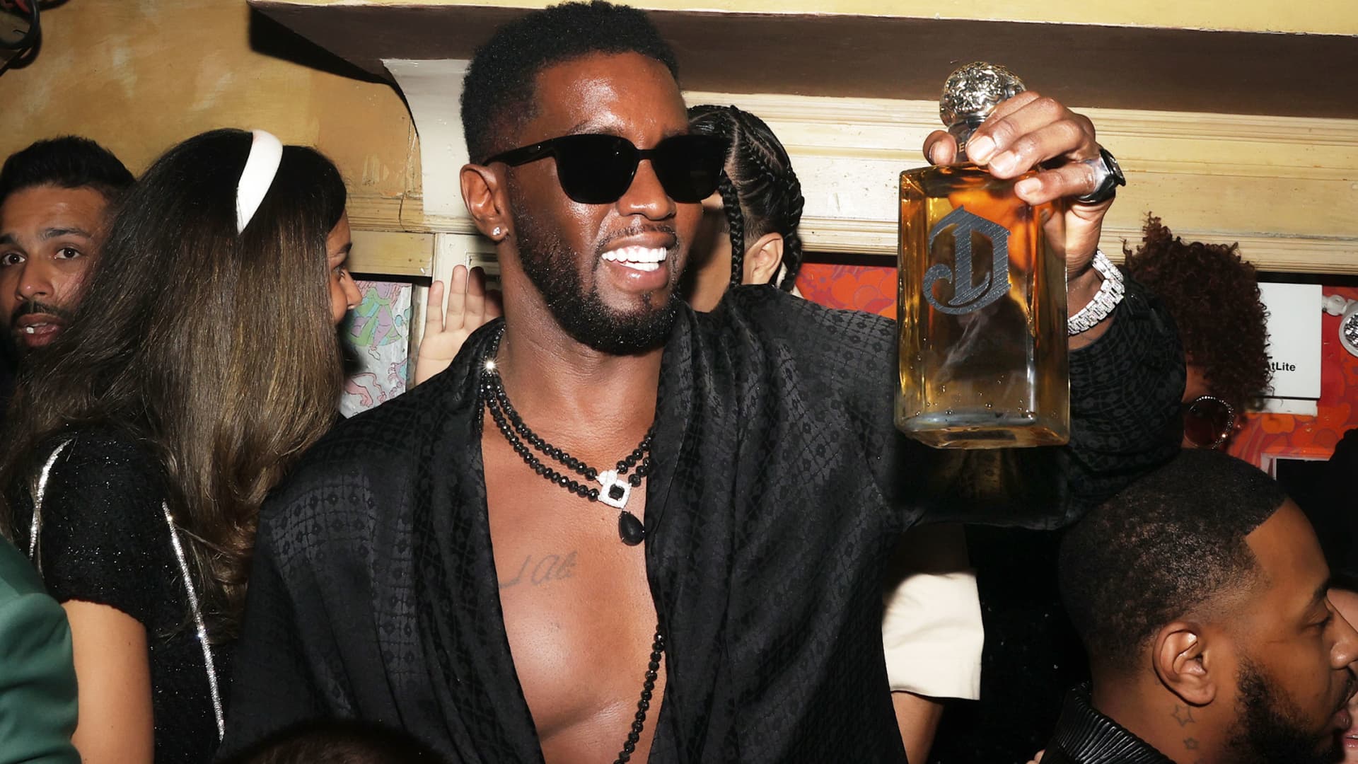 Diddy sues liquor company for neglect and racism.