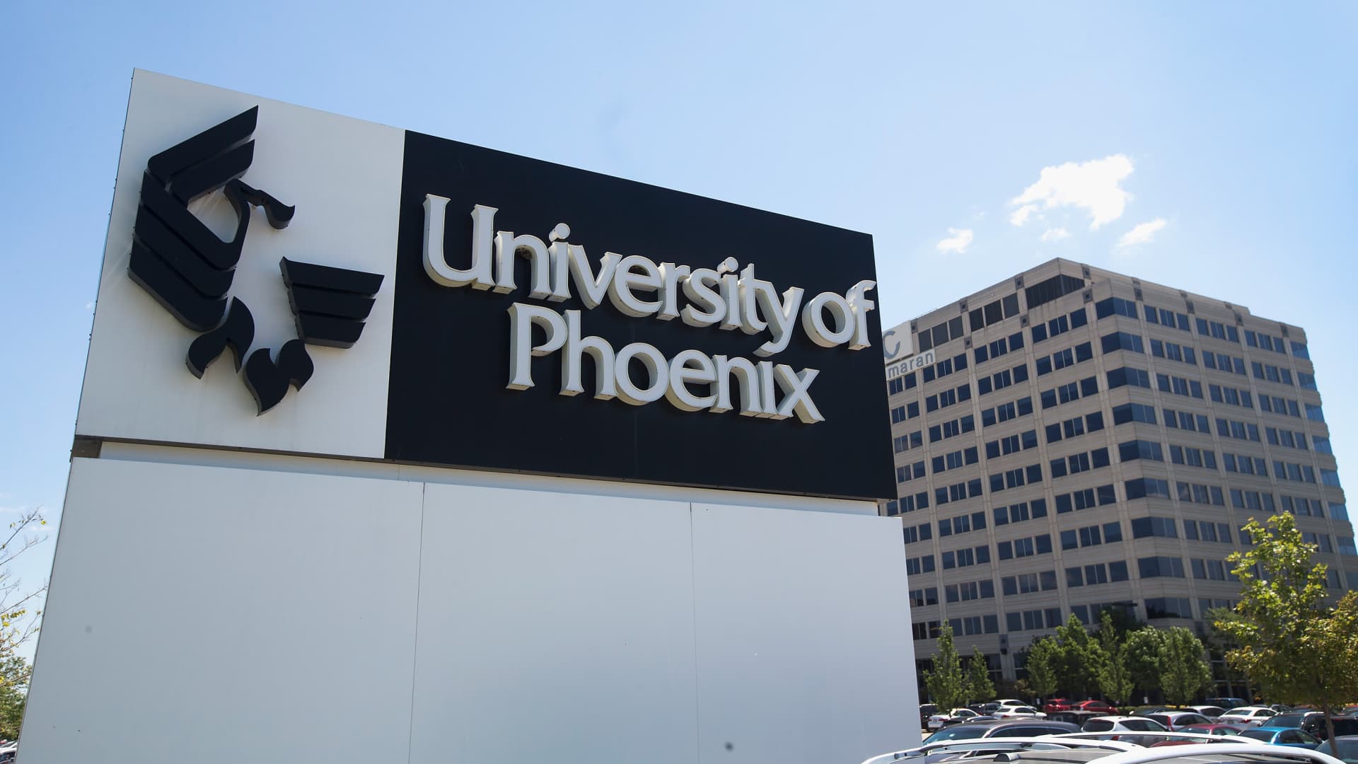 Featured image for "Biden administration forgives millions in student debt for defrauded borrowers, while system faces challenges"