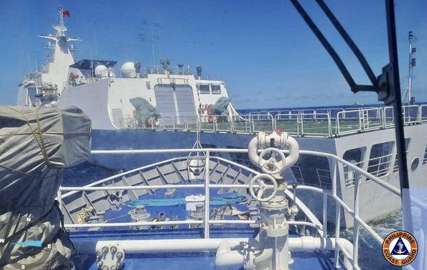 "Philippine Military Denounces Chinese Coast Guard's Aggressive Tactics in Disputed Waters"