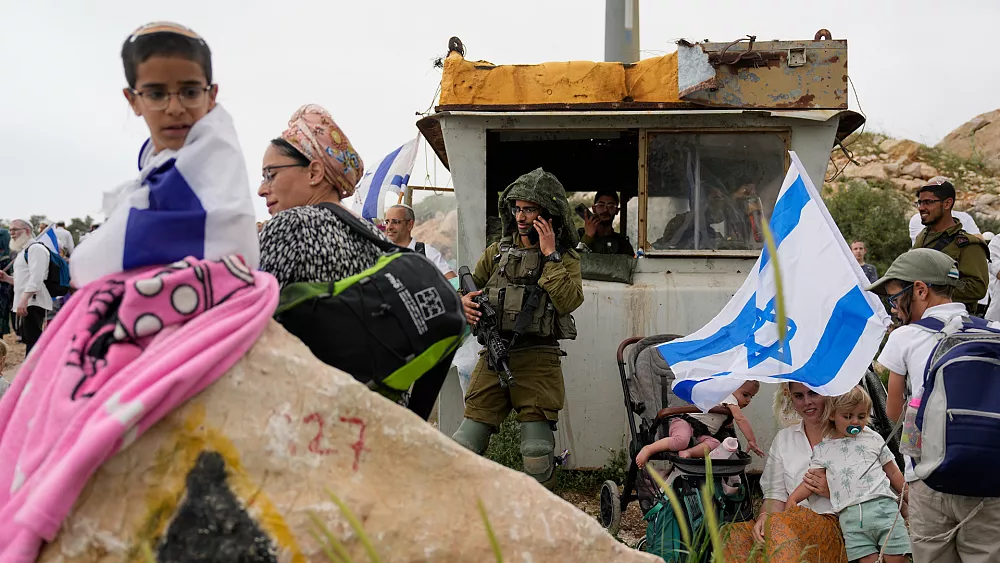 Israeli Settlers and Ministers Lead Thousands in West Bank March to Illegal Outpost