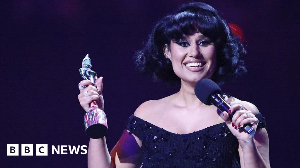 Featured image for "Raye Makes History with Record-Breaking Wins at 2024 BRIT Awards"