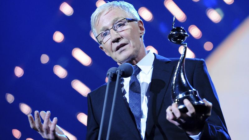 Featured image for Beloved British TV host and comedian Paul O'Grady dies at 67, tributes pour in.