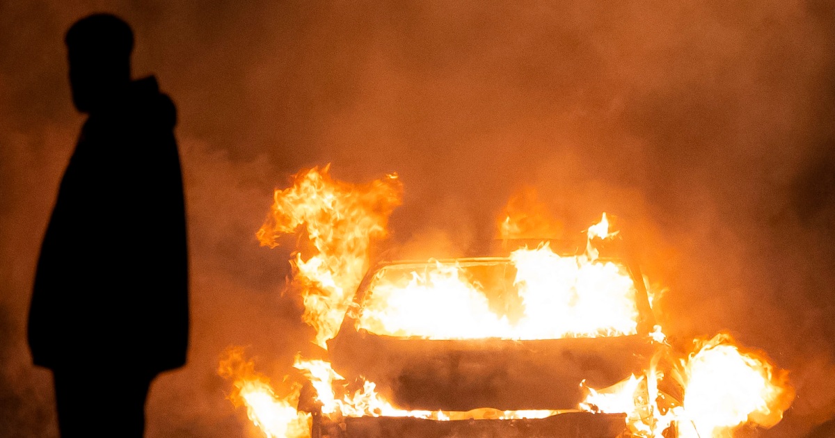 "UK Police Confront Large Scale Disorder Following Cardiff Car Fires"