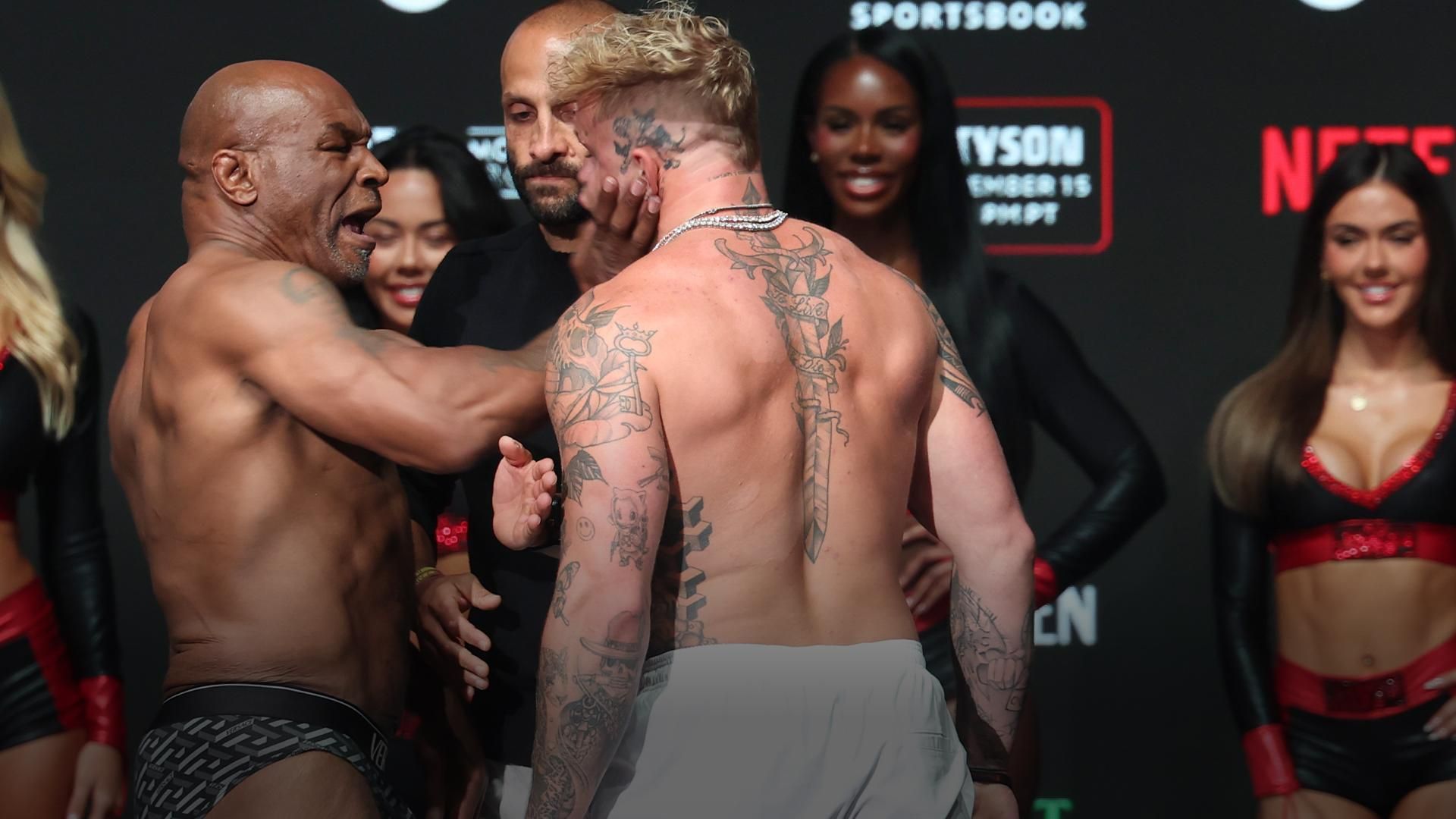 Featured image for Mike Tyson Slaps Jake Paul During Tense Pre-Fight Staredown