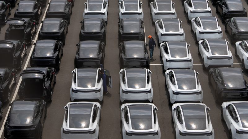 Featured image for Tesla Faces Challenges Amid Earnings Drop and Market Uncertainty