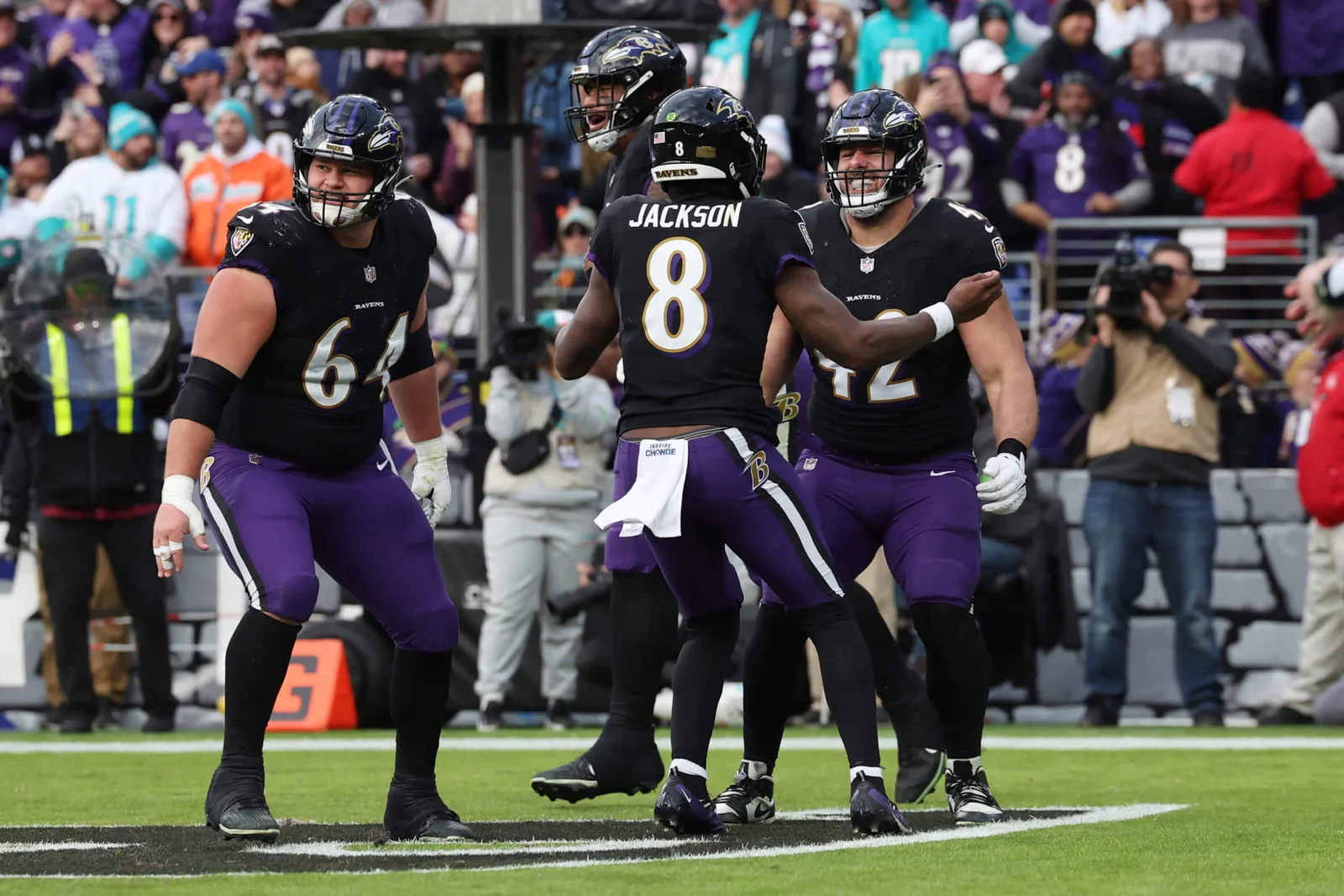 "Ravens and 49ers Secure Top Playoff Seeds as East Division Titles Hang in Balance"