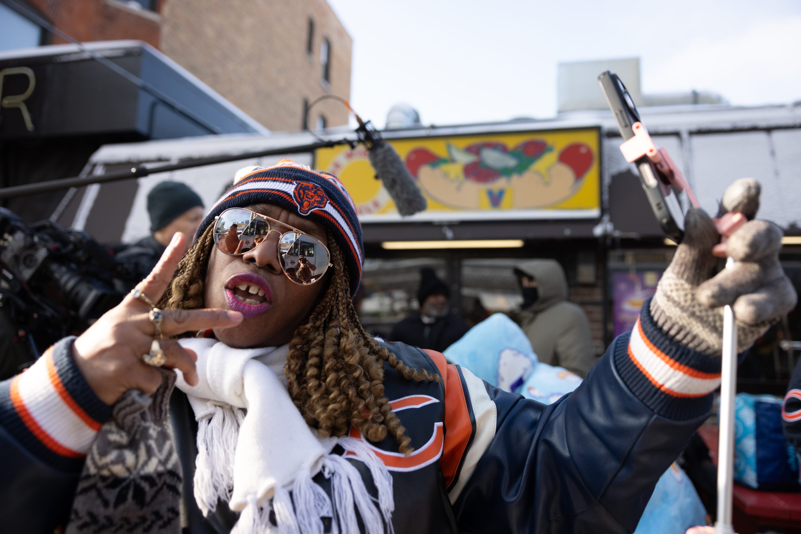 Featured image for Bears Fans Celebrate Coach's Shirtless Win Celebration and Hot Dog Giveaway