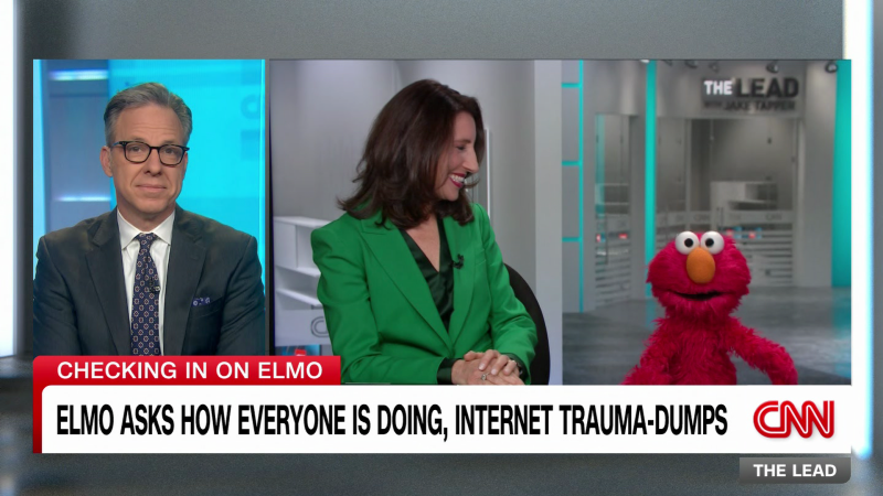 Featured image for "Jake Tapper's Heartwarming Visit with Elmo Goes Viral"