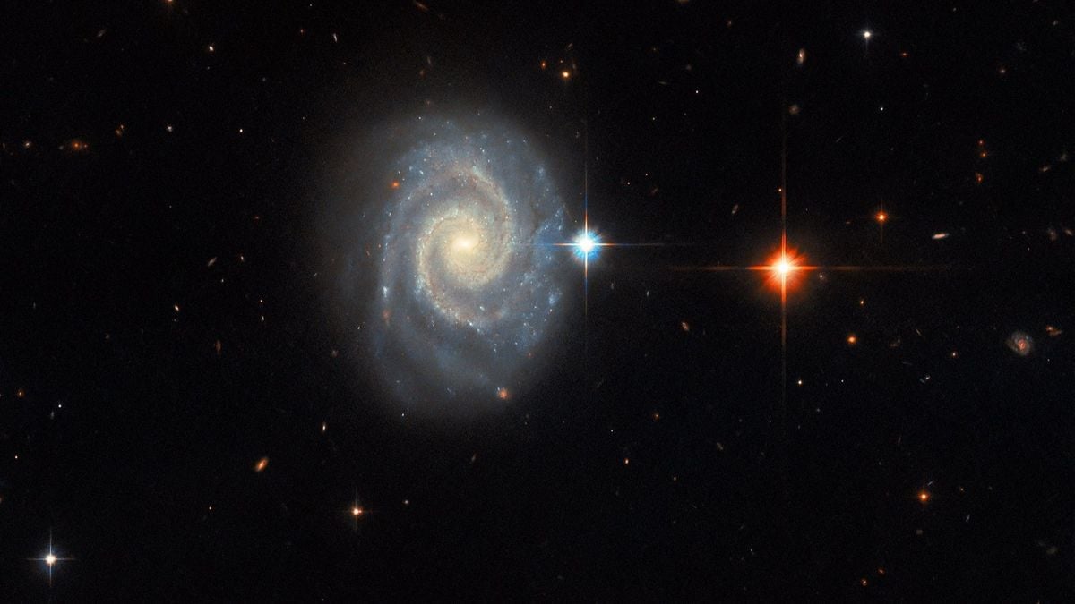 Featured image for Hubble Telescope's Stunning Image Reveals "Forbidden" Light from Spiral Galaxy