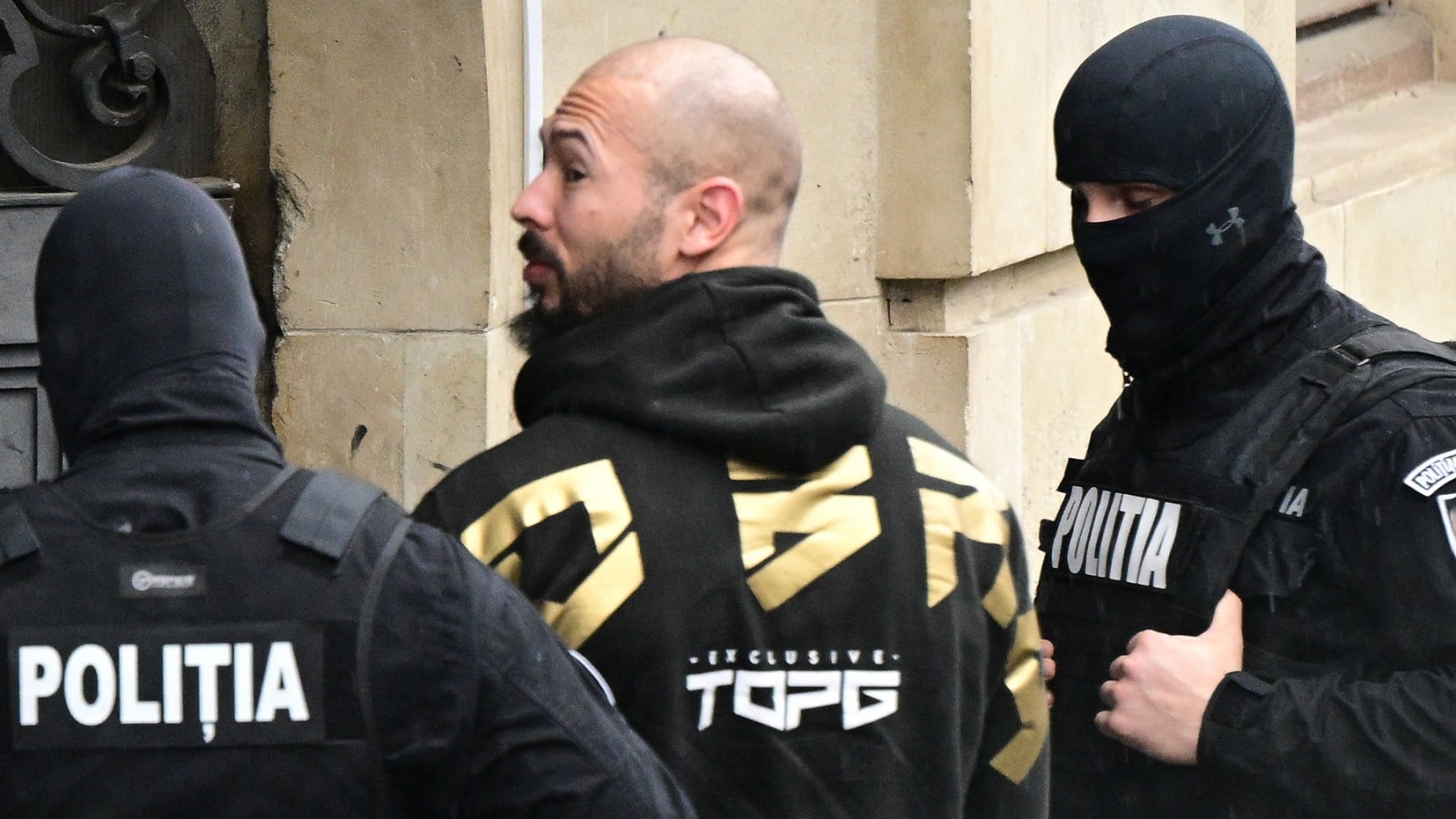 Featured image for Andrew Tate and Brother Detained in Romania Linked to UK Arrest Warrant