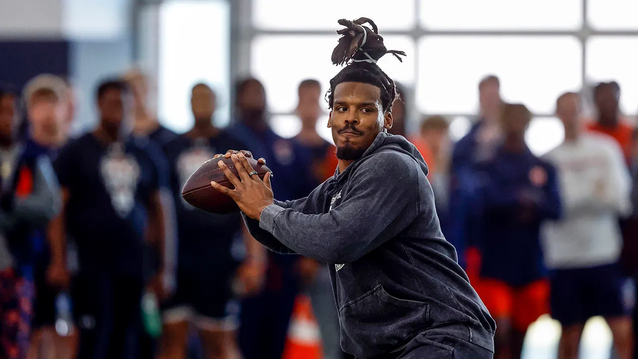 Cam Newton showcases arm at Auburn's Pro Day, eyes NFL comeback.