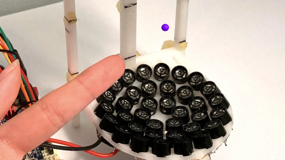 Handheld Time Crystal Levitates on a Sonic Cushion