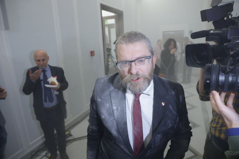 "Controversial Polish Lawmaker's Shocking Act: Extinguishing Hanukkah Candles in Parliament"