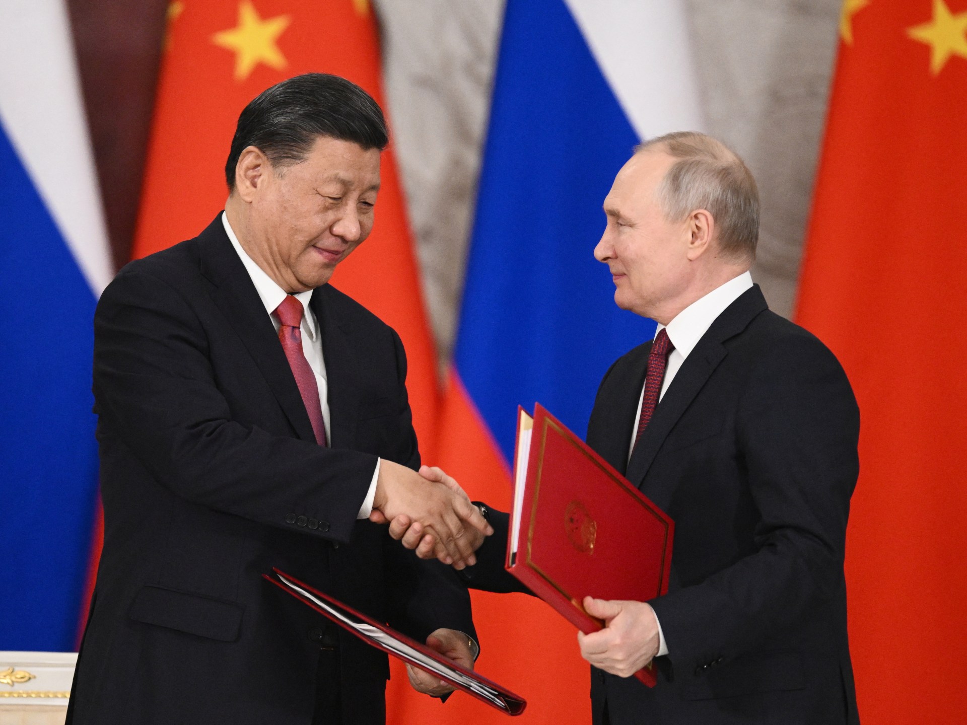 Xi Jinping and Vladimir Putin strengthen ties with economic deal.