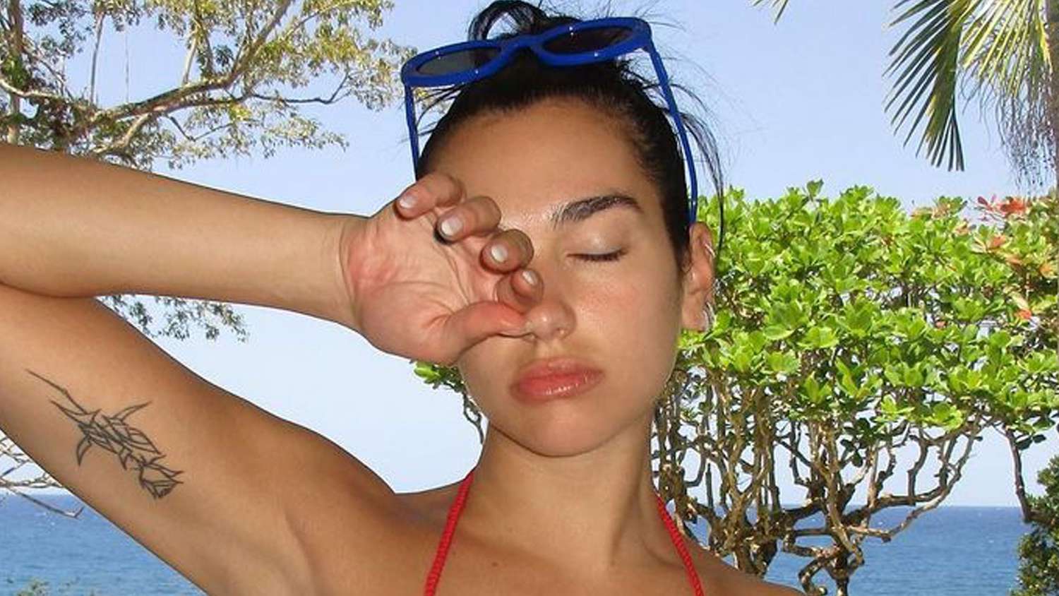 Featured image for Dua Lipa Rocks Colorful Bikinis on Vacation