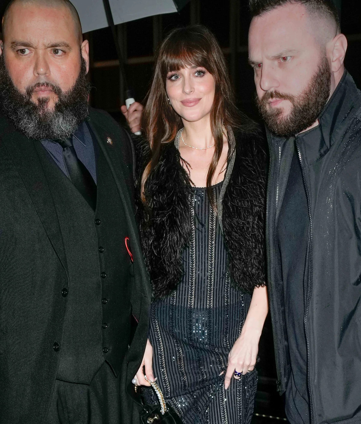 "Dakota Johnson Stuns in Plunging Black Jumpsuit on 'SNL'"