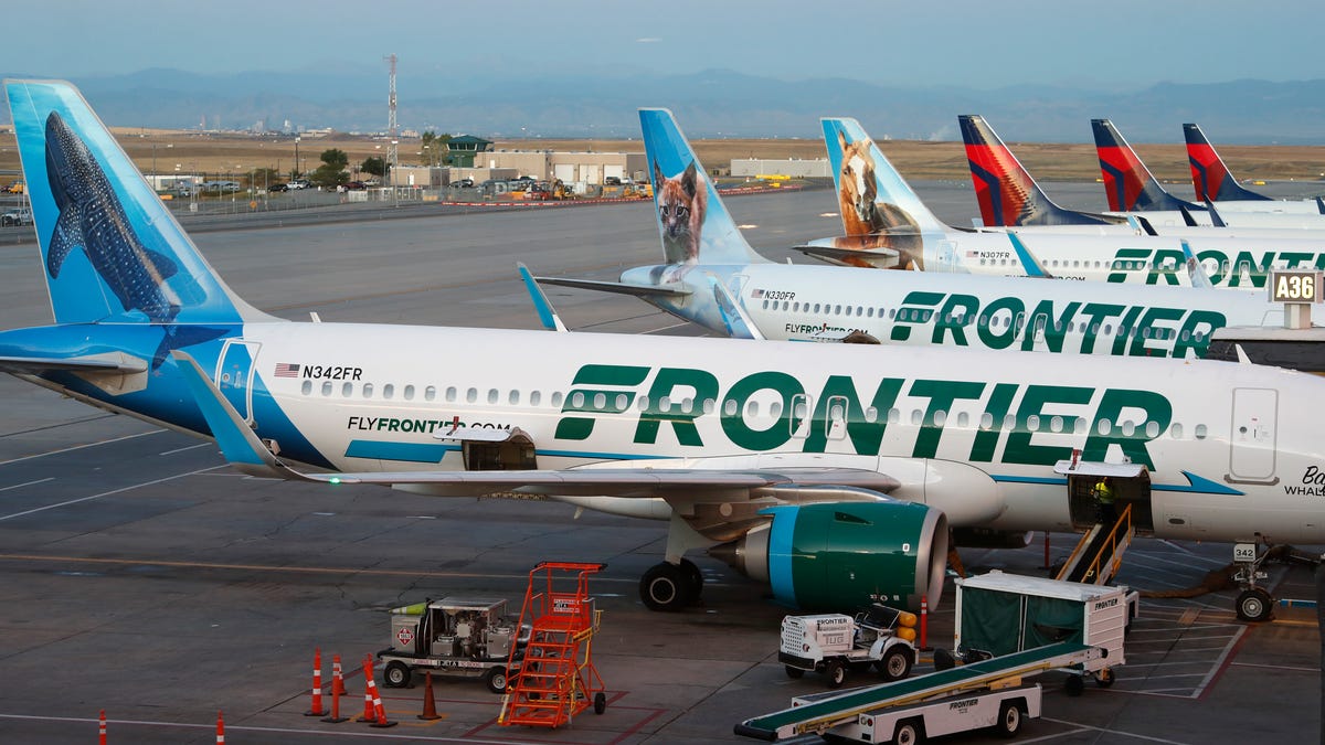 Passengers vote to remove disruptive woman from Frontier Airlines flight.