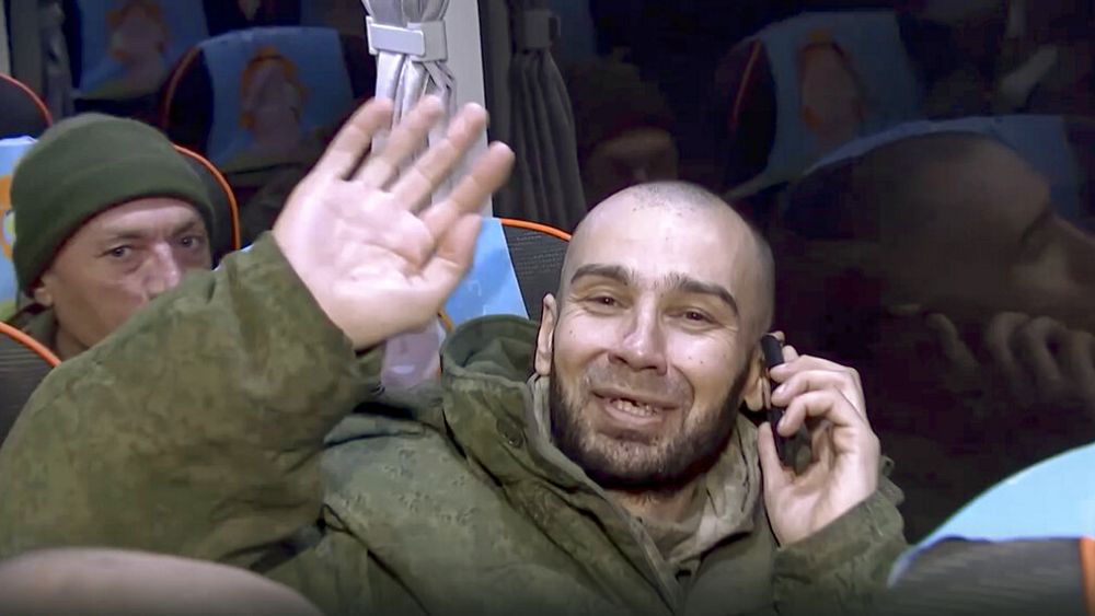 "Russia and Ukraine exchange prisoners, over 200 troops return home"