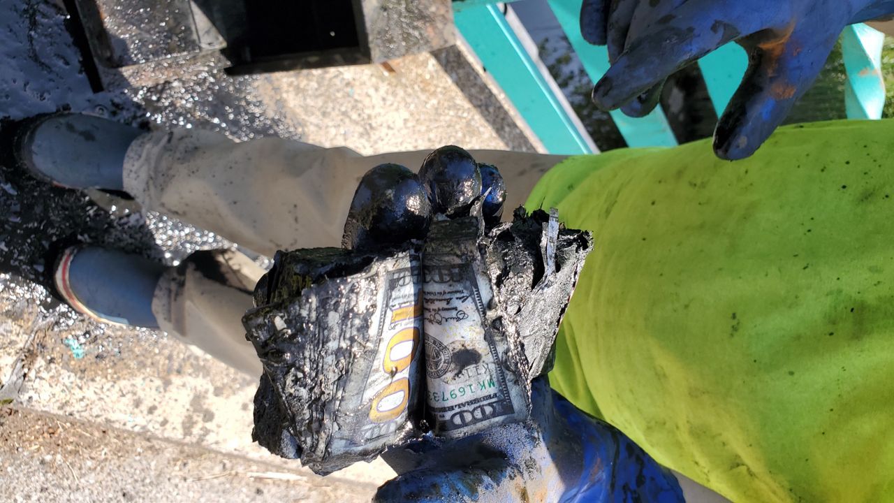 Featured image for Couple Finds $100K in Cash While Magnet Fishing in NYC Park