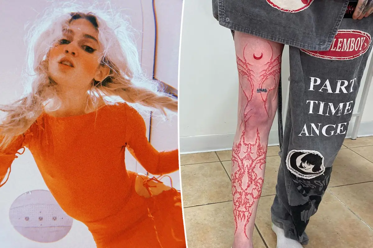 Featured image for Grimes' Latest Ink: Massive Red Leg Tattoo from Ankle to Thigh