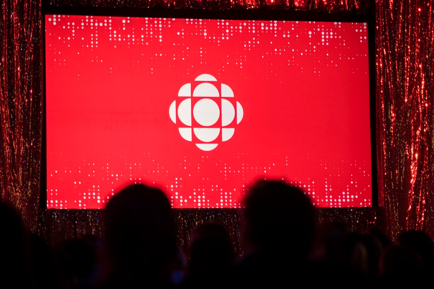 Featured image for CBC halts Twitter use amid controversy over government funding label.
