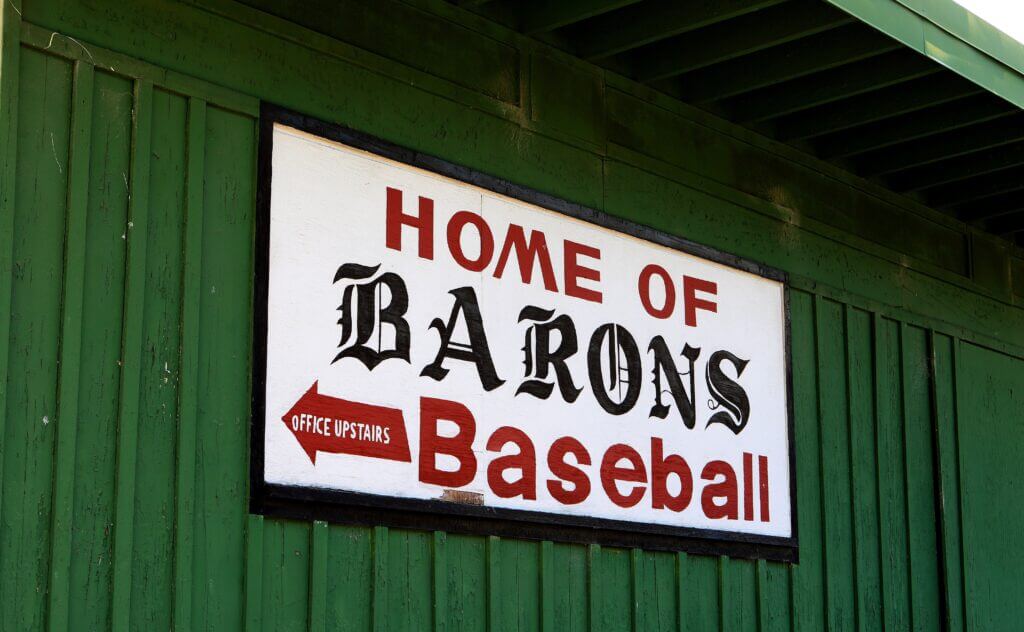 Featured image for MLB's 2024 Field of Dreams game split between Rickwood Field and Iowa.