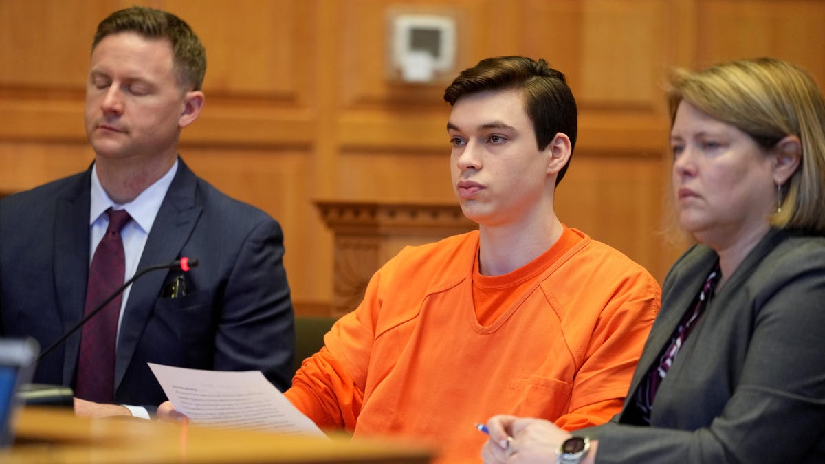 Two men plead guilty in Iowa teacher's murder.