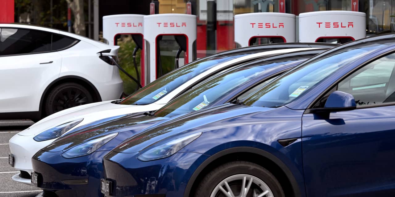 Tesla's stock downgraded twice in two days as analysts turn cautious.