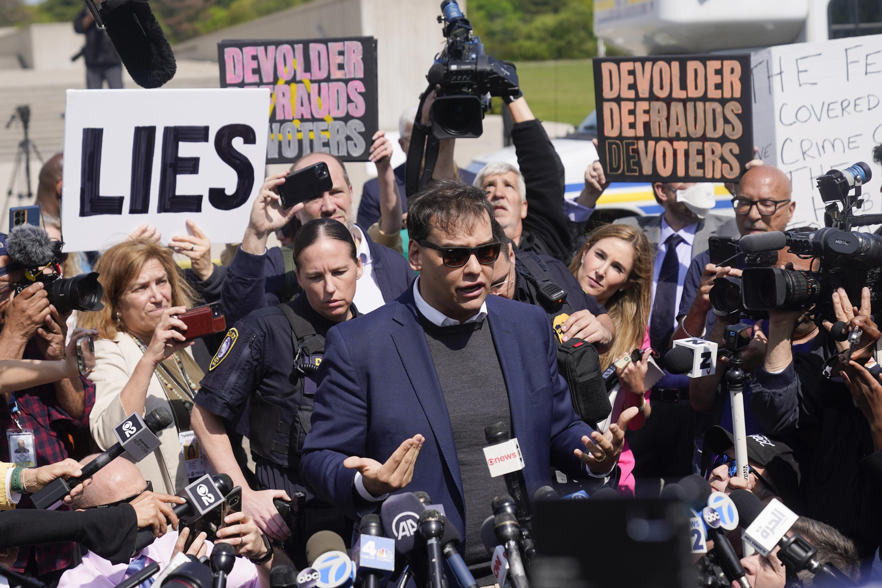 George Santos maintains innocence and refuses to step down amidst federal charges.