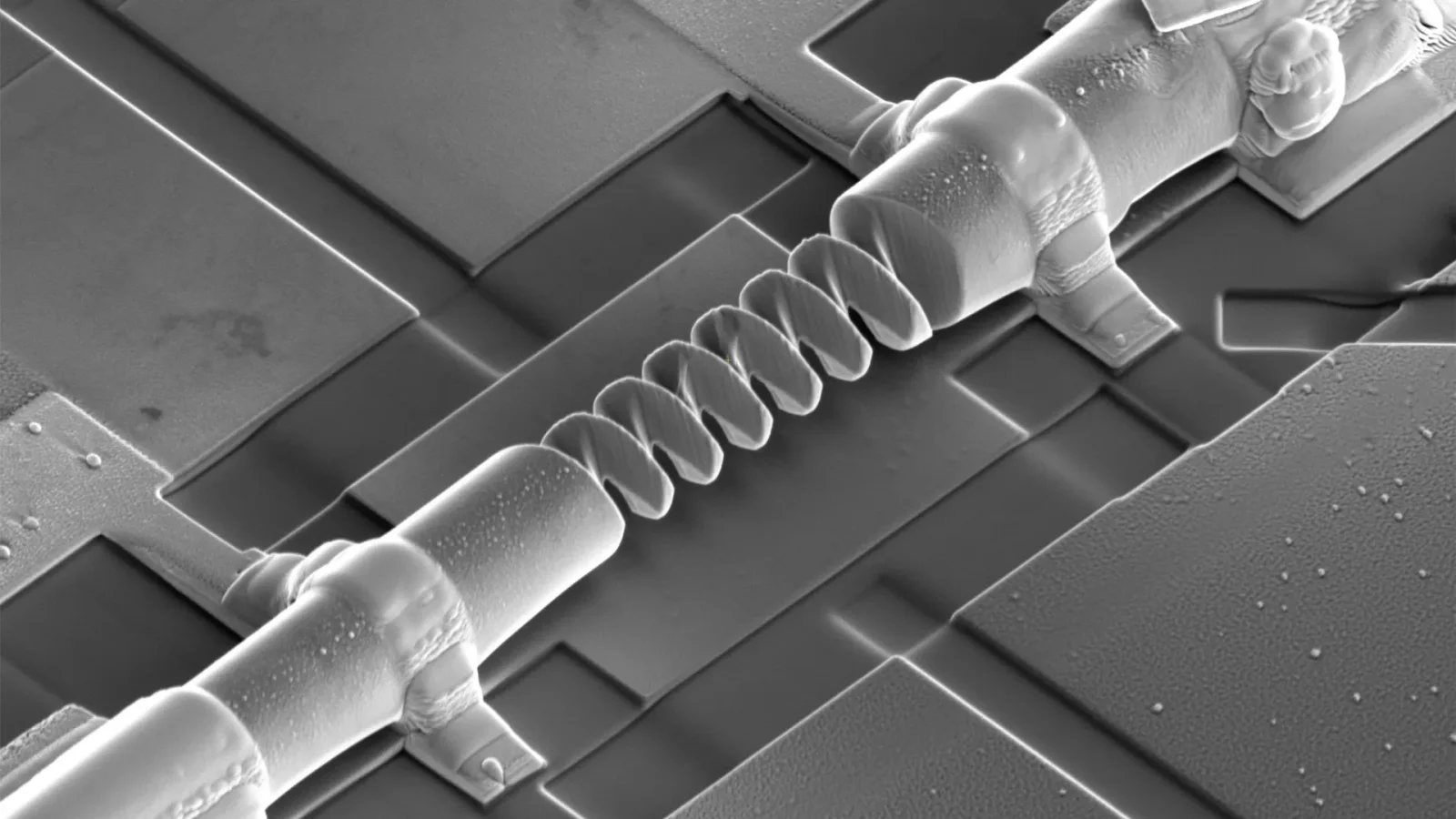 3D nanocoils turn geometry into switchable diodes