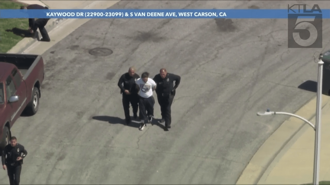 Wild LA police chase ends in suspect's capture after jumping between vehicles.
