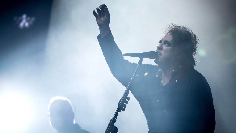 The Cure's Robert Smith disgusted by Ticketmaster's fees for North American tour.