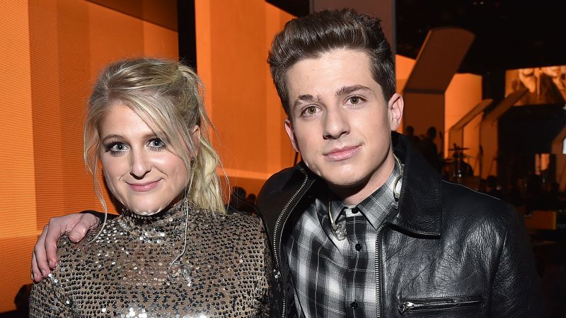 Featured image for Charlie Puth spills on past kiss with Meghan Trainor and infamous "I'm Hungies" comment.
