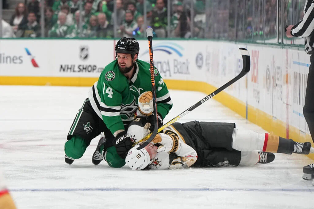 Stars' Jamie Benn faces hearing for cross-checking as fans cause chaos in playoff game.