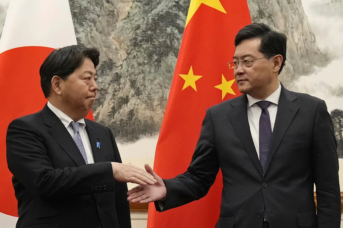 Japan demands release of detained citizen and warns China over military ties.