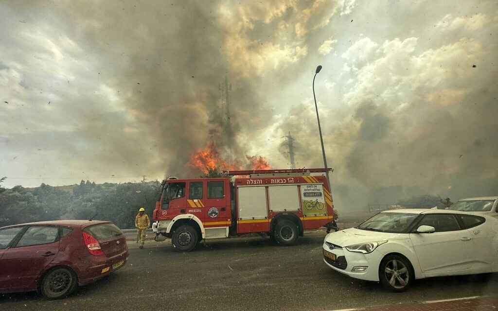 Israel's Heatwave Ignites Hundreds of Blazes, Firefighters Fight On.