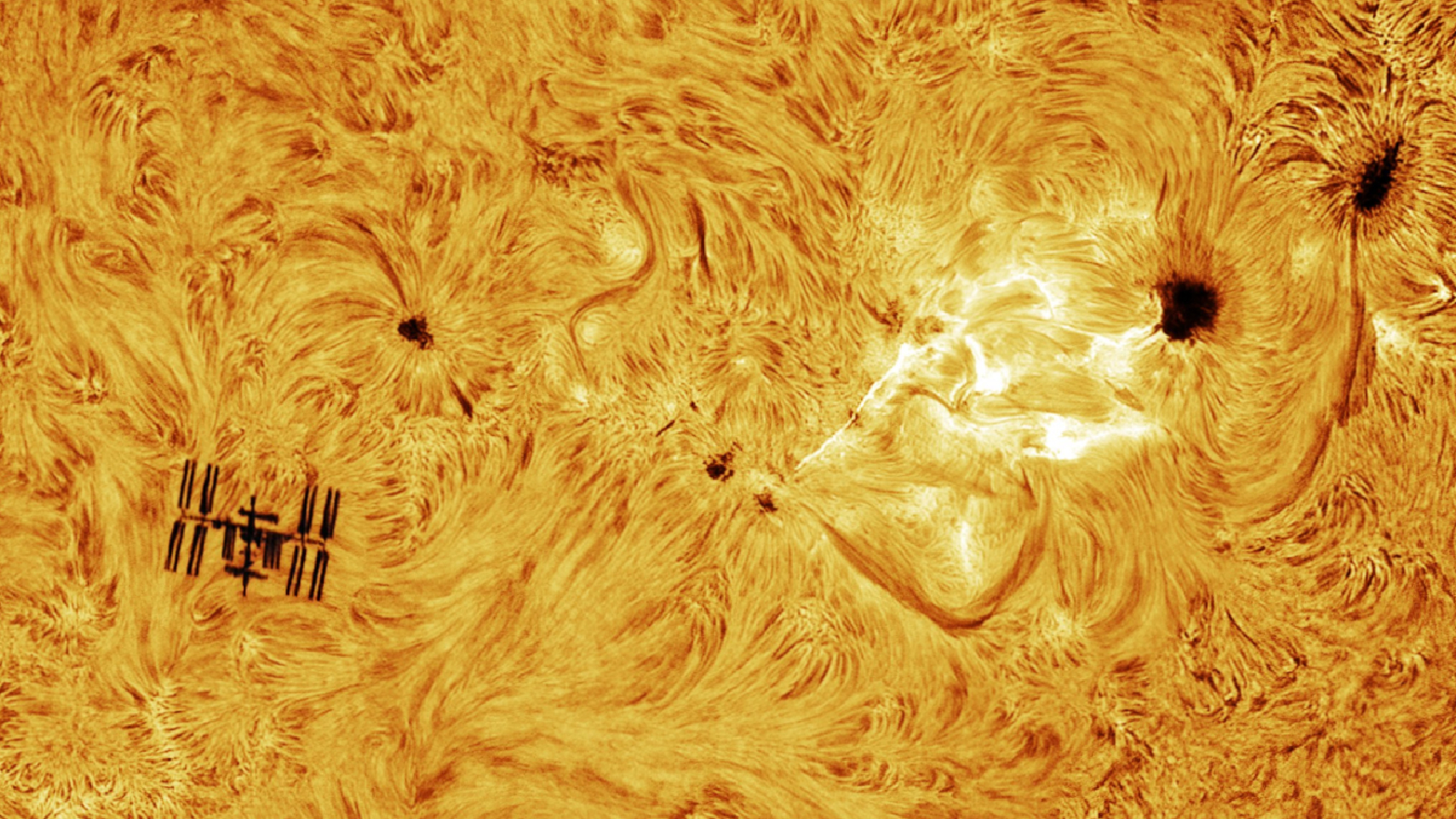 Featured image for Astrophotographer Captures Rare Solar Flare and ISS Transit in Stunning Shot