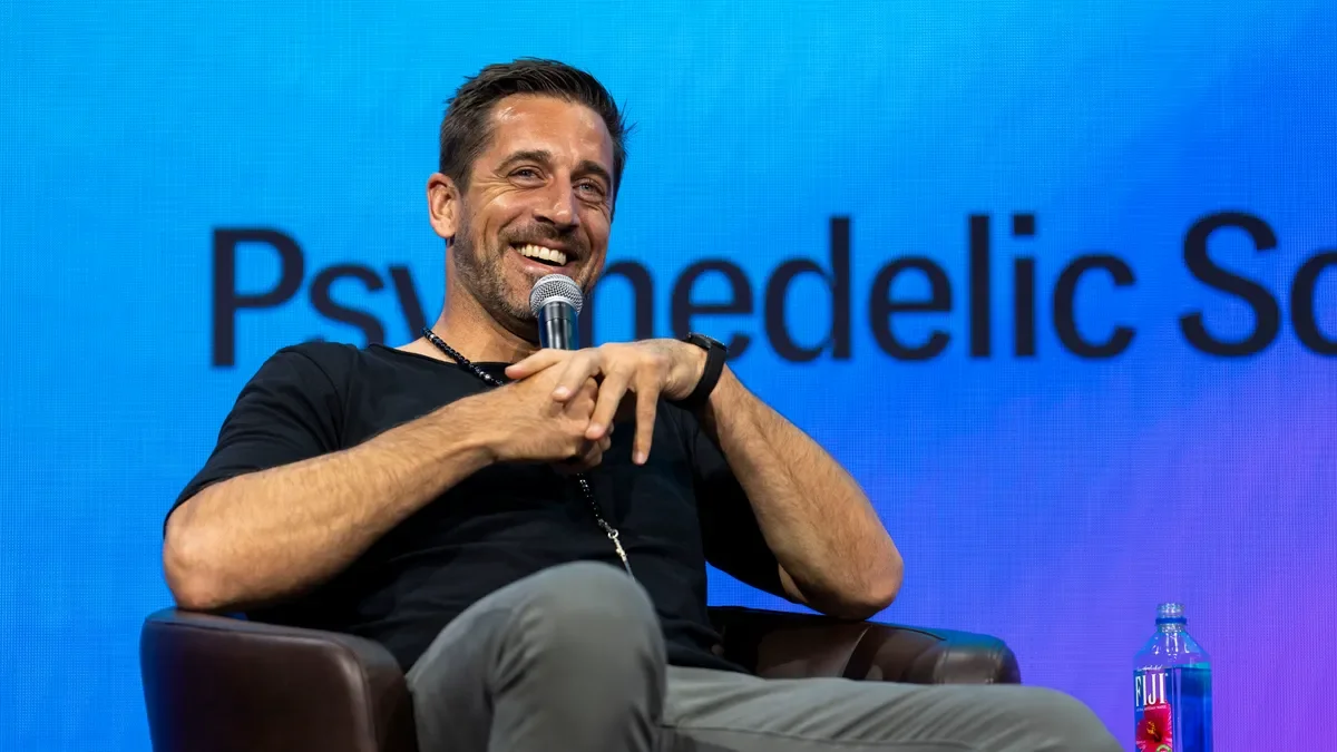 Aaron Rodgers advocates for psychedelics and mental health at conference.