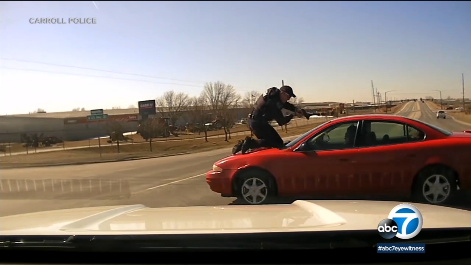Iowa Police Officer Holds On For Dear Life During High-Speed Car Chase