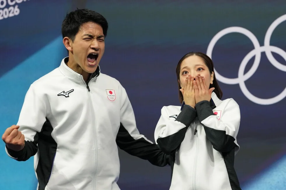 Japan claims its first Olympic gold in pairs figure skating as Miura and Kihara set a world record
