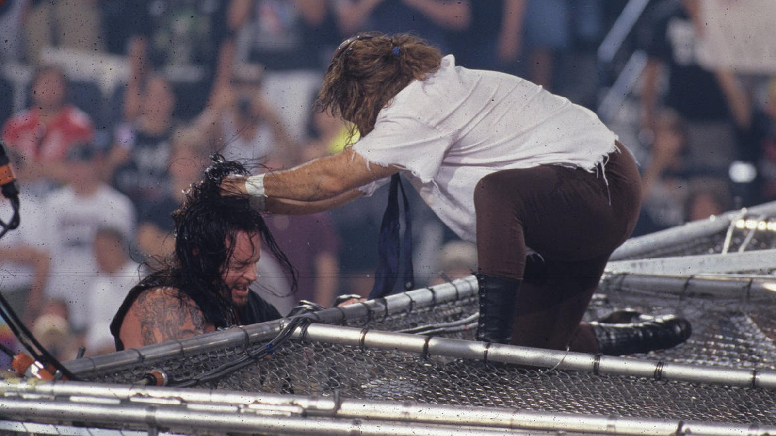 Featured image for Undertaker and Mick Foley revisit historic Hell in a Cell match.
