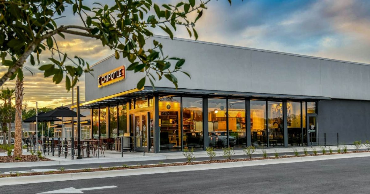 Chipotle's Sustainable and All-Electric Restaurant Design with Solar Panels and EV Chargers.