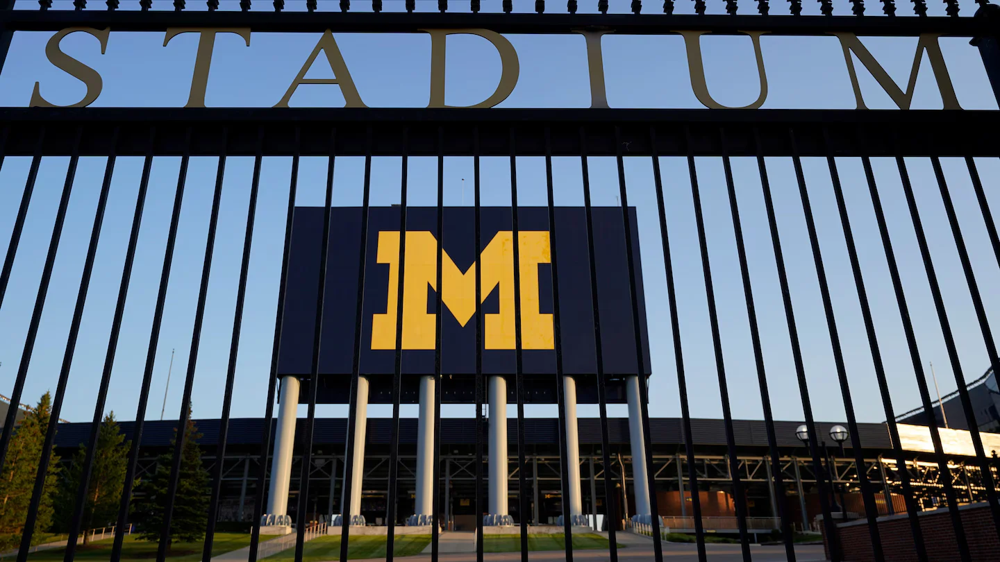 Schembechler family members resign from Michigan positions over social media controversy.