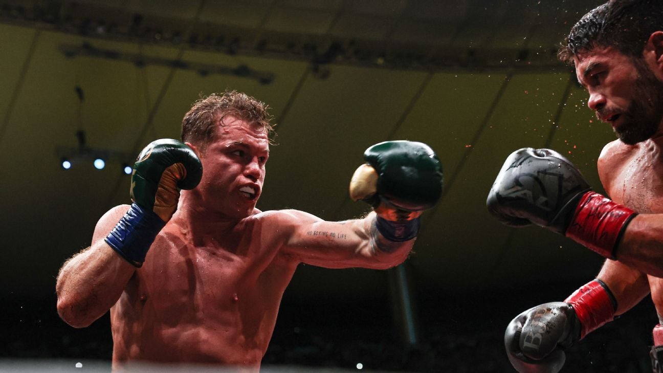 Featured image for Canelo Alvarez defeats Ryder by decision in boxing match.