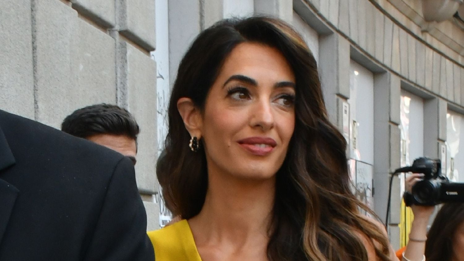 Amal Clooney's Stylish Summer: From Controversial Accessories to Romantic Italian Outings