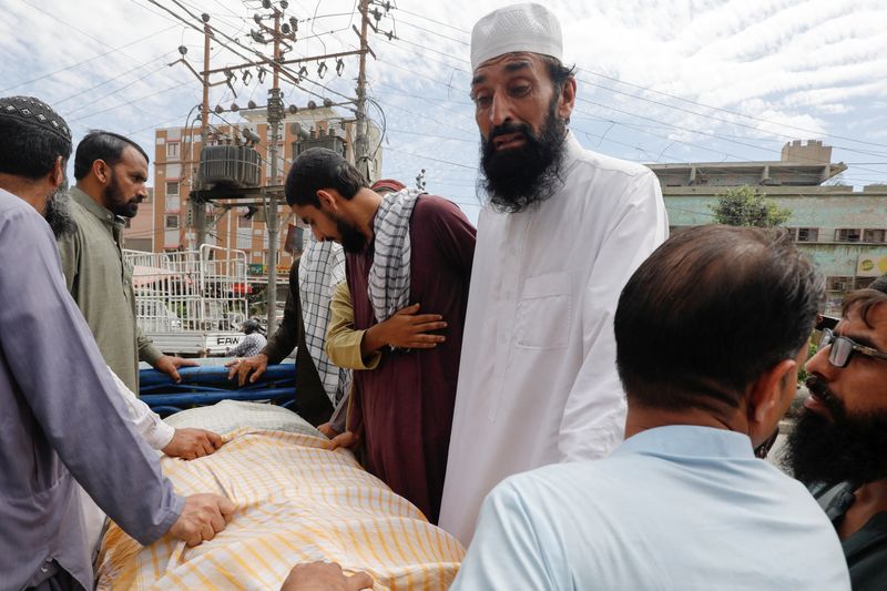 Pakistanis in deadly scramble for scarce donations.