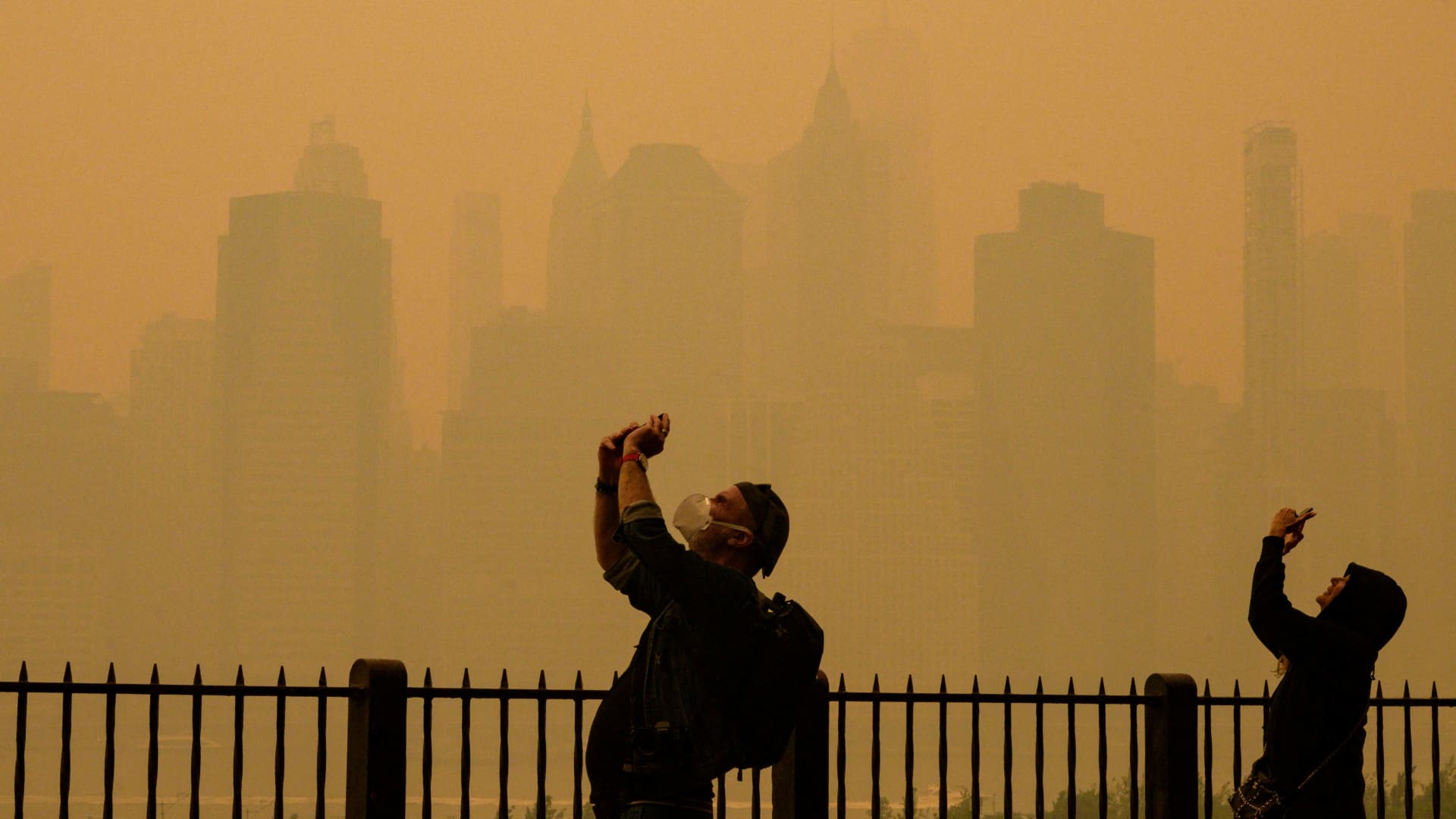 Wildfire smoke from Canada disrupts air travel and prompts health warnings in the Eastern U.S.