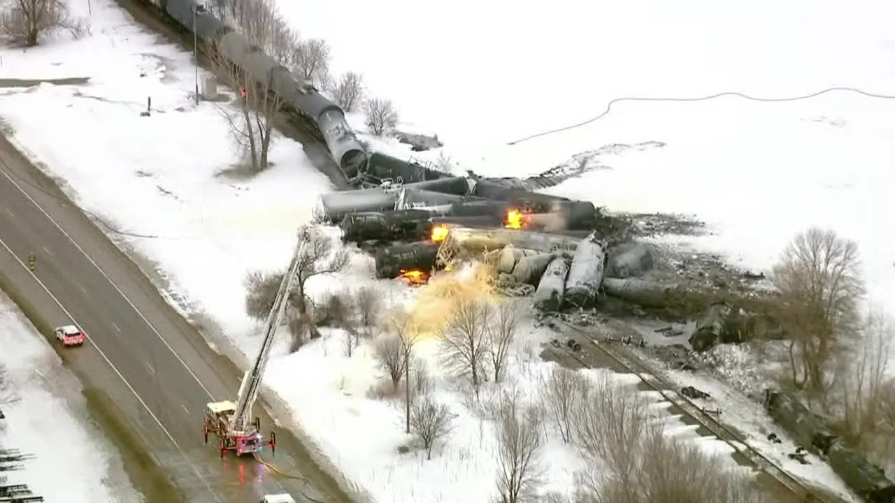 Train carrying ethanol derails and catches fire, forcing evacuations in Minnesota town.