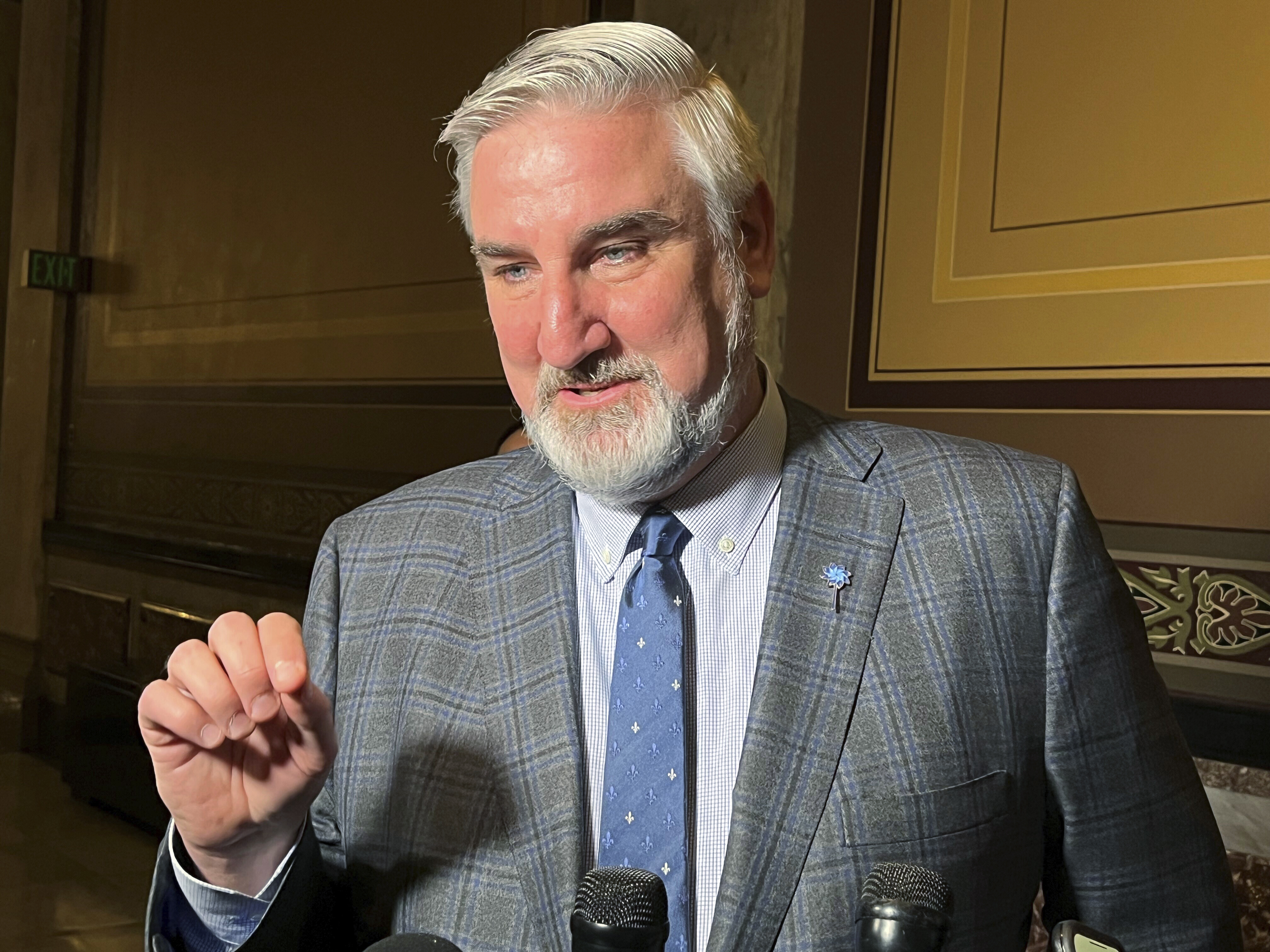 Indiana governor outlaws gender-affirming care.